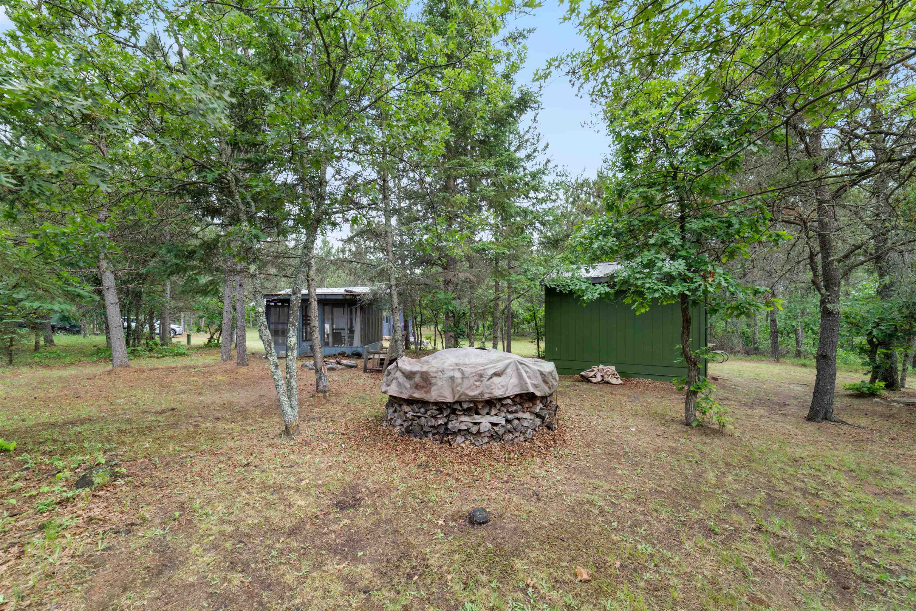 11321 East Town Line Road Solon Springs, WI 54873 - Photo 23 of 31 View of yard with an outdoor fire pit and an outdoor structure