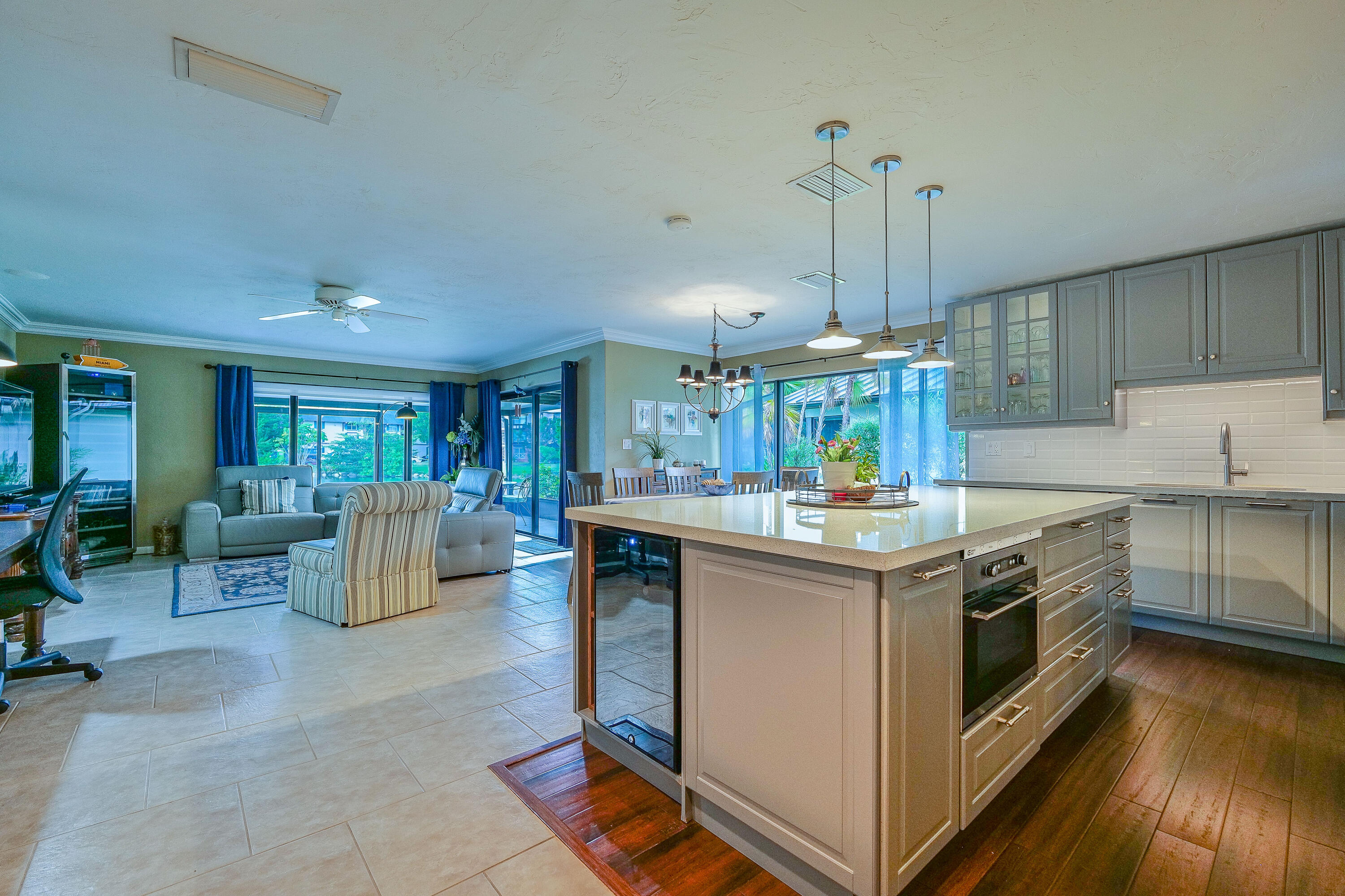 5535 Constant Spring Terrace, Unit 216 Lauderhill, FL 33319 - Photo 12 of 51 a kitchen with kitchen island granite countertop a stove and a wooden floors