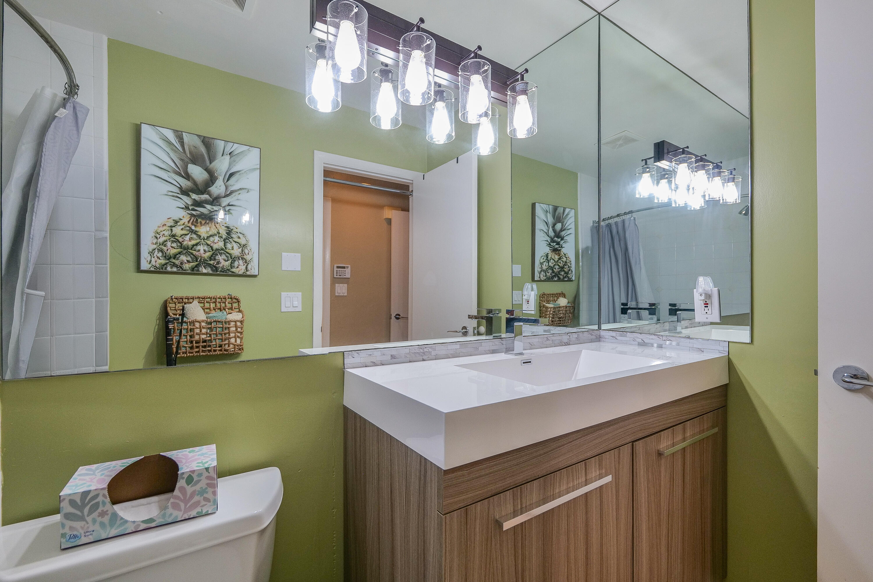 5535 Constant Spring Terrace, Unit 216 Lauderhill, FL 33319 - Photo 18 of 51 a bathroom with a sink a large mirror and a bathtub