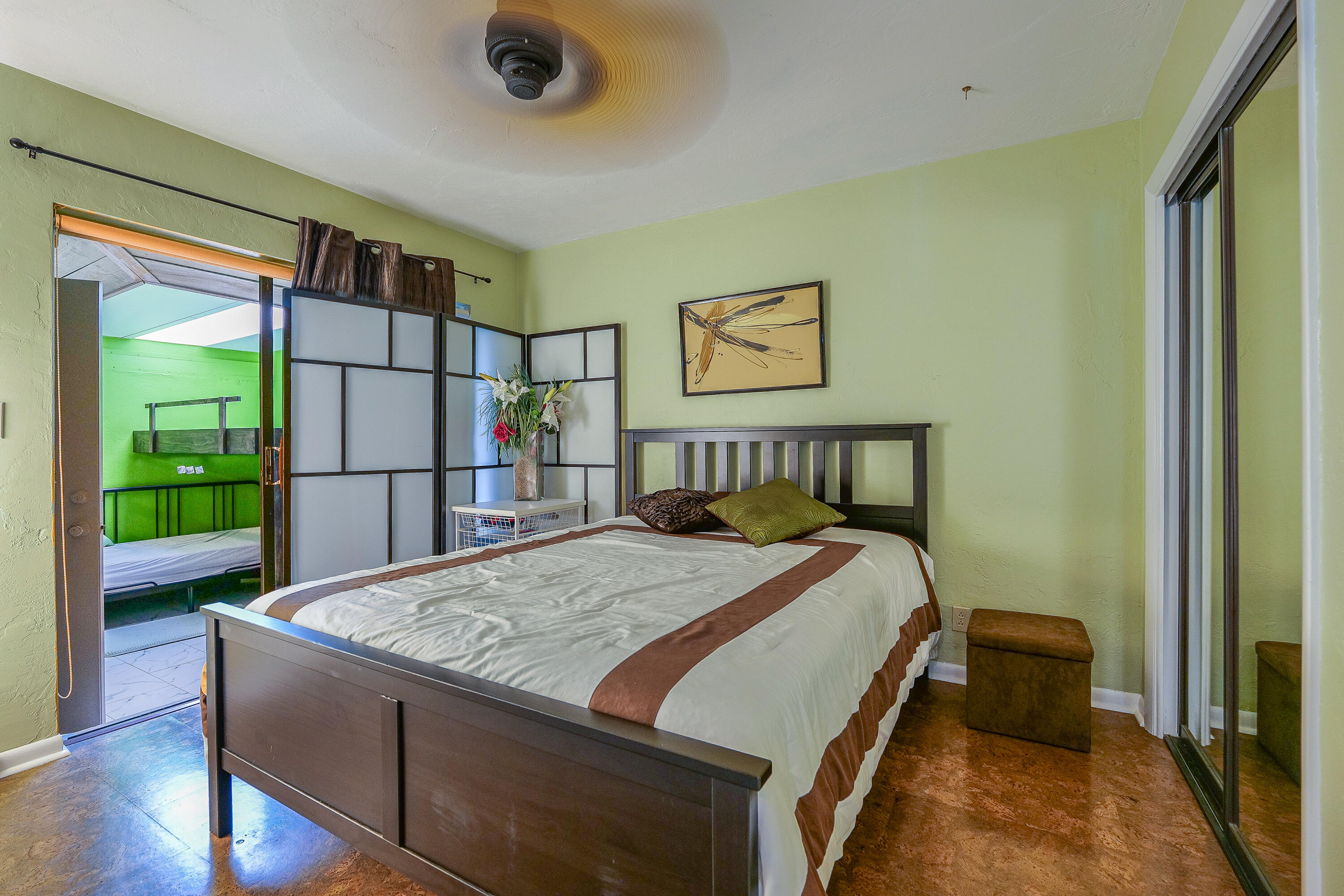 5535 Constant Spring Terrace, Unit 216 Lauderhill, FL 33319 - Photo 20 of 51 a bed sitting in a bedroom next to a window