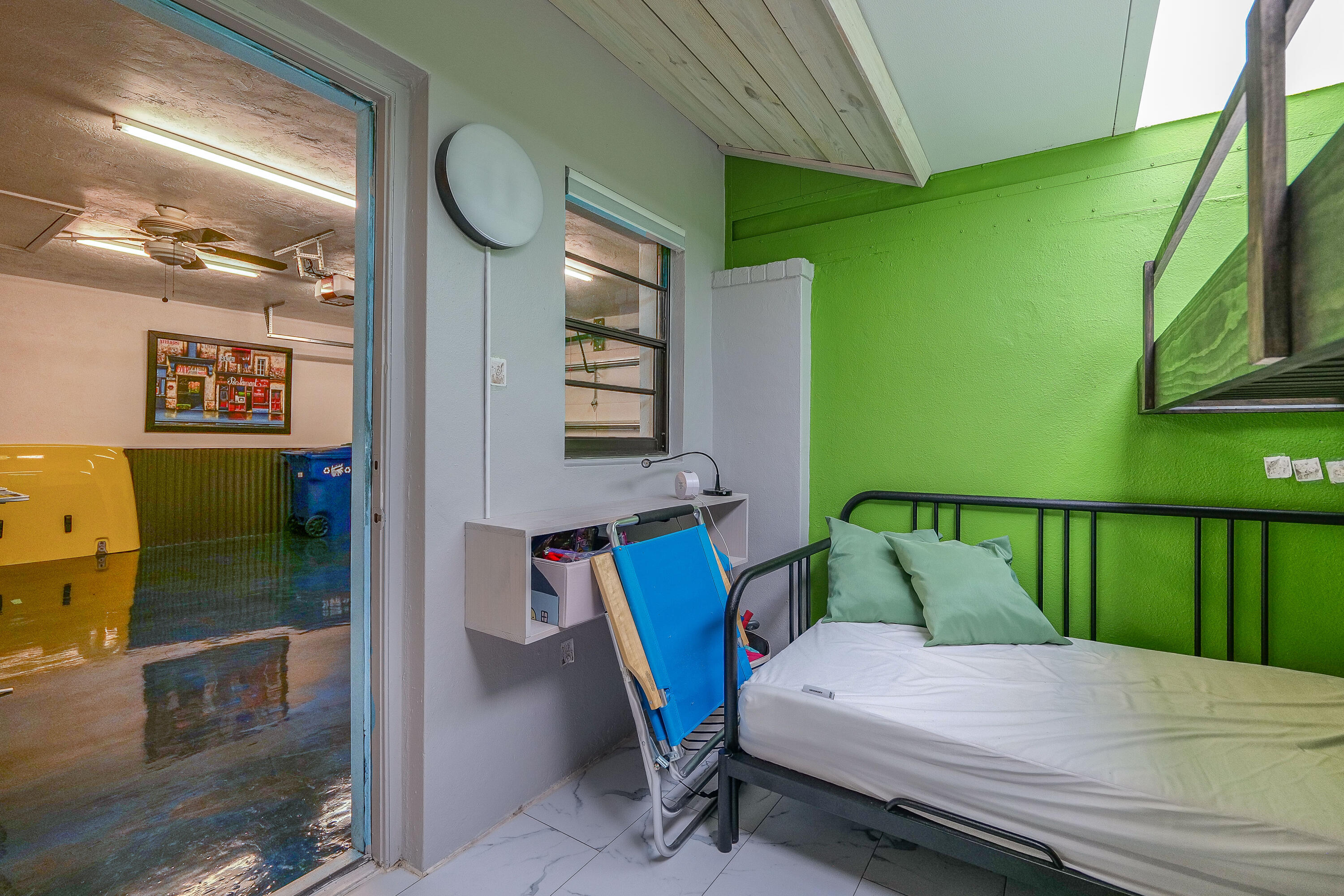 5535 Constant Spring Terrace, Unit 216 Lauderhill, FL 33319 - Photo 22 of 51 a bedroom with bed and a large window