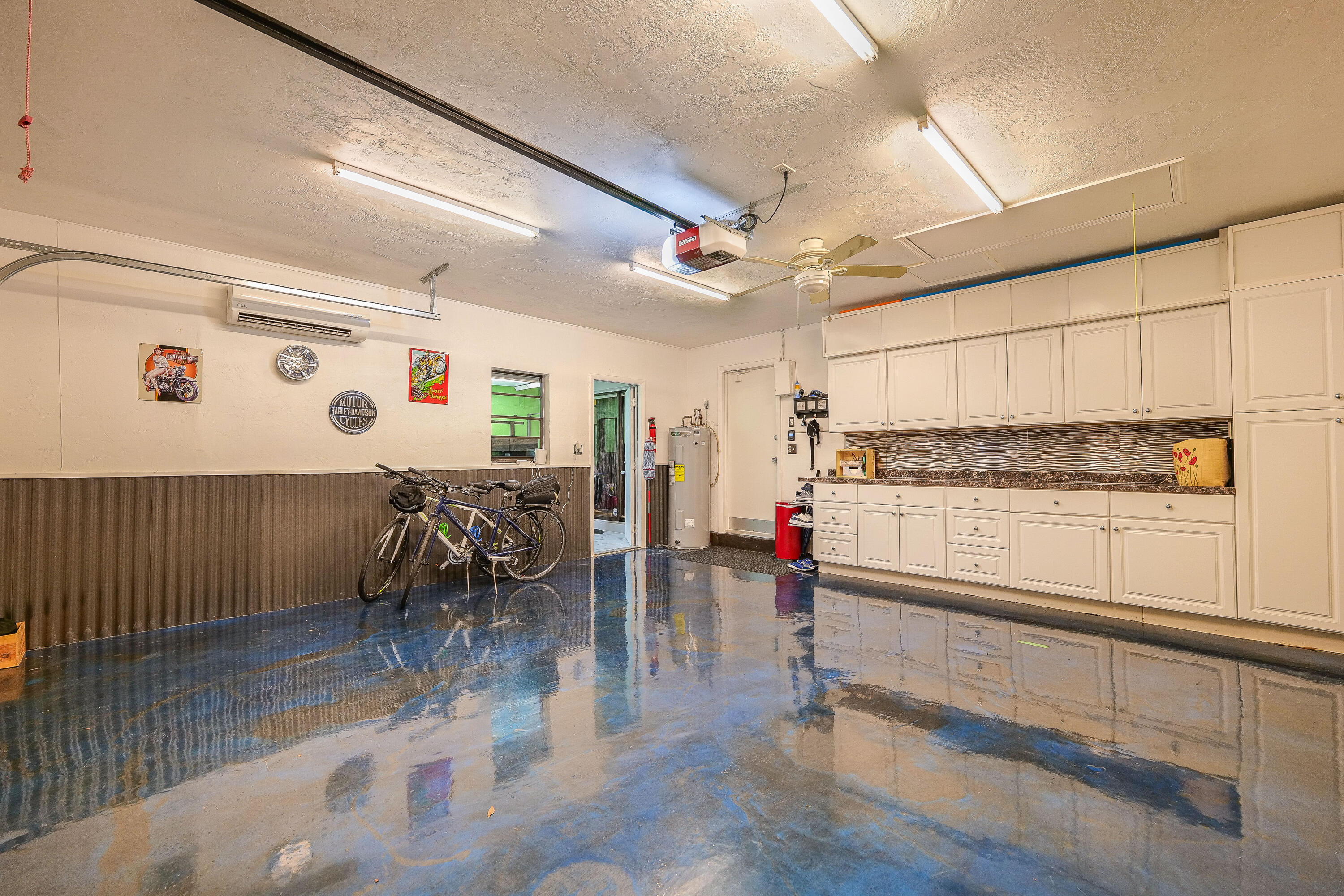 5535 Constant Spring Terrace, Unit 216 Lauderhill, FL 33319 - Photo 31 of 51 a kitchen with stainless steel appliances dining table chairs and wooden floor
