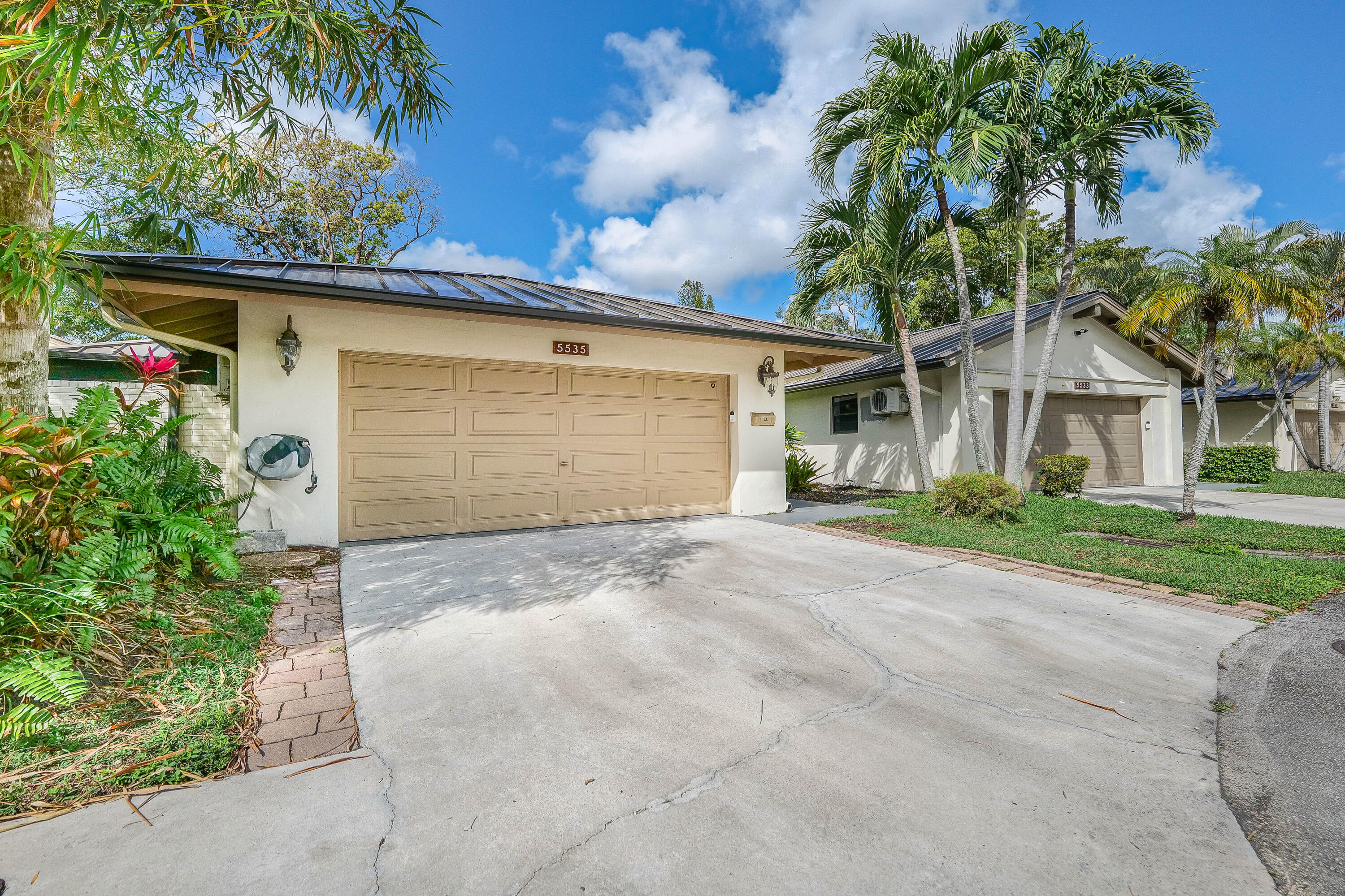 5535 Constant Spring Terrace, Unit 216 Lauderhill, FL 33319 - Photo 33 of 51 front view of house with a yard