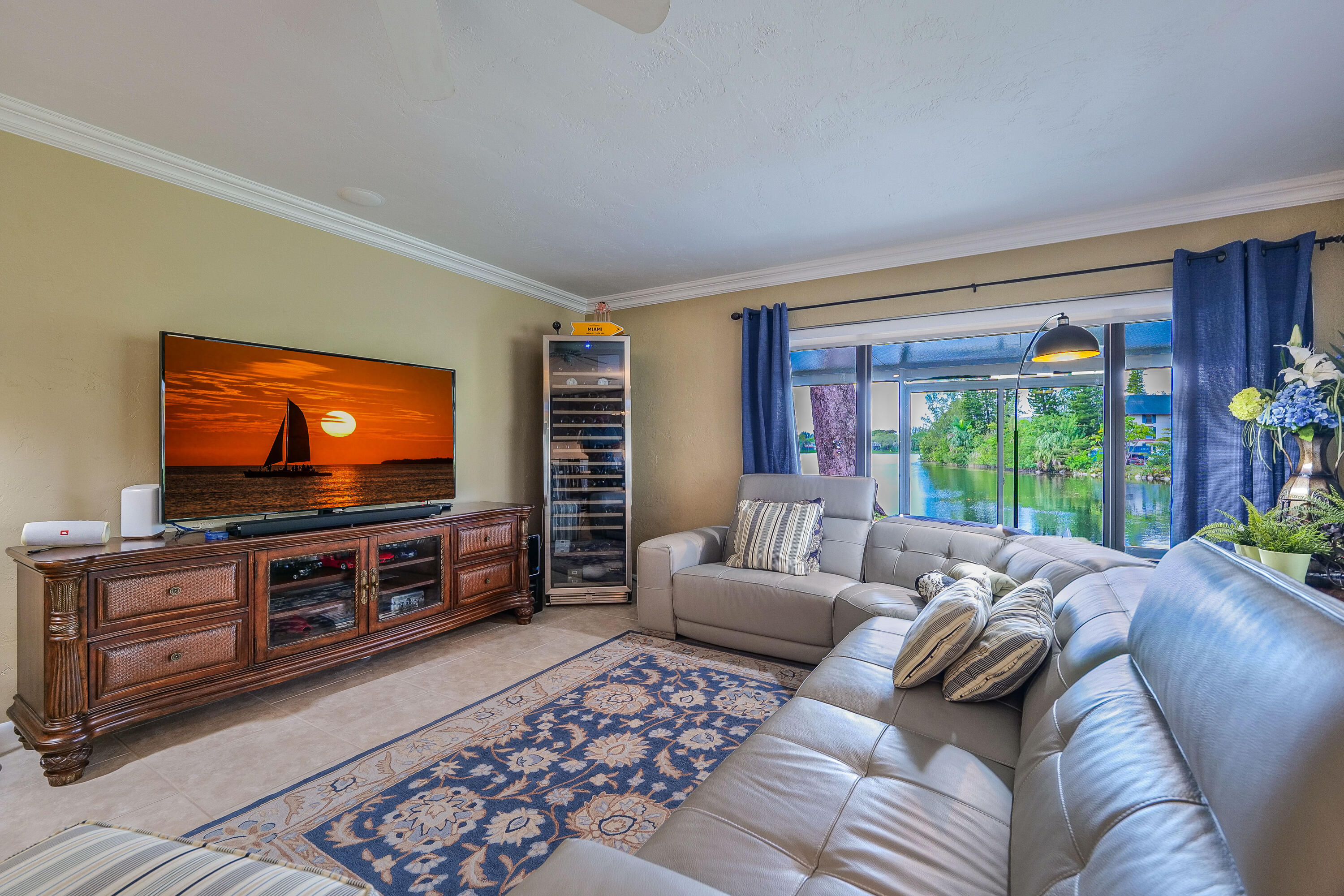 5535 Constant Spring Terrace, Unit 216 Lauderhill, FL 33319 - Photo 5 of 51 a living room with furniture and a flat screen tv
