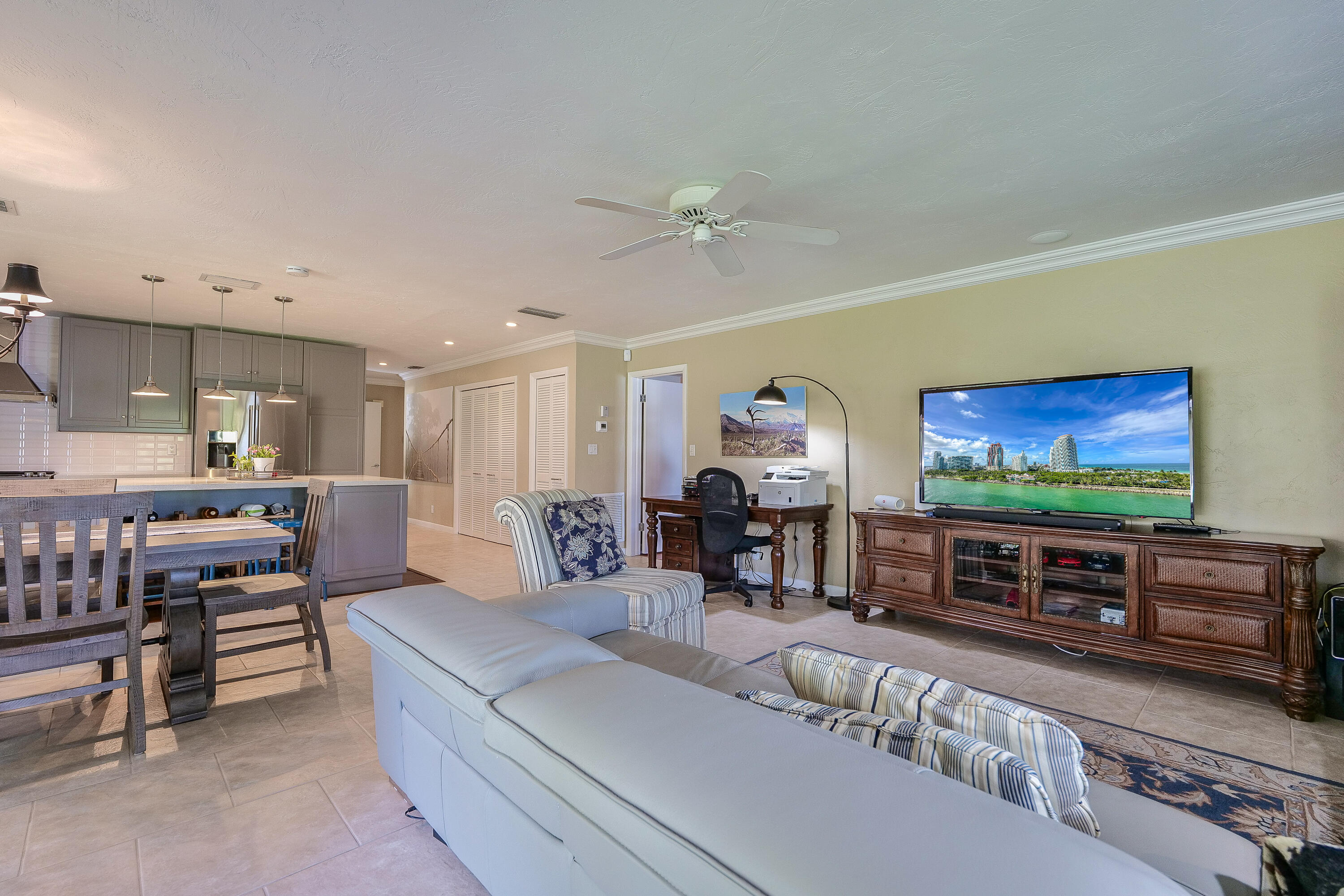 5535 Constant Spring Terrace, Unit 216 Lauderhill, FL 33319 - Photo 7 of 51 a living room with furniture and a flat screen tv