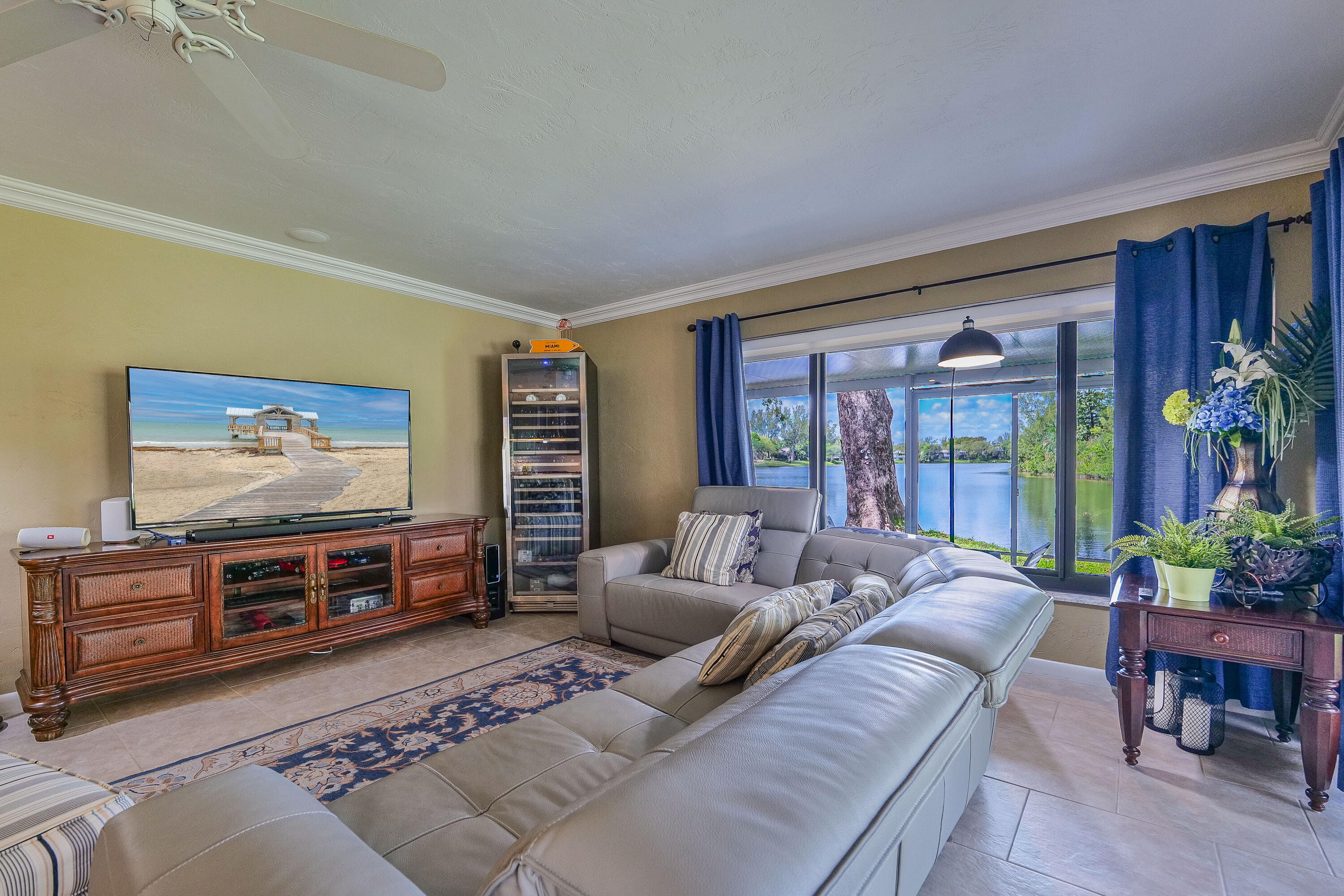 5535 Constant Spring Terrace, Unit 216 Lauderhill, FL 33319 - Photo 8 of 51 a living room with furniture and a flat screen tv