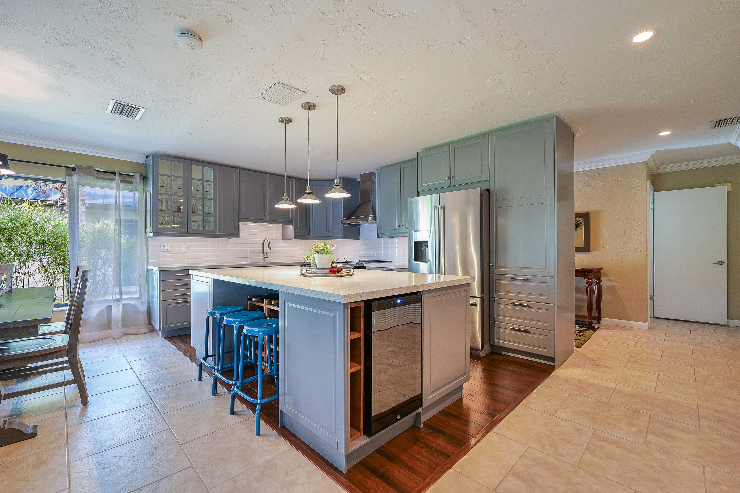 5535 Constant Spring Terrace, Unit 216 Lauderhill, FL 33319 - Photo 9 of 51 a kitchen with a refrigerator a sink dishwasher and wooden cabinets