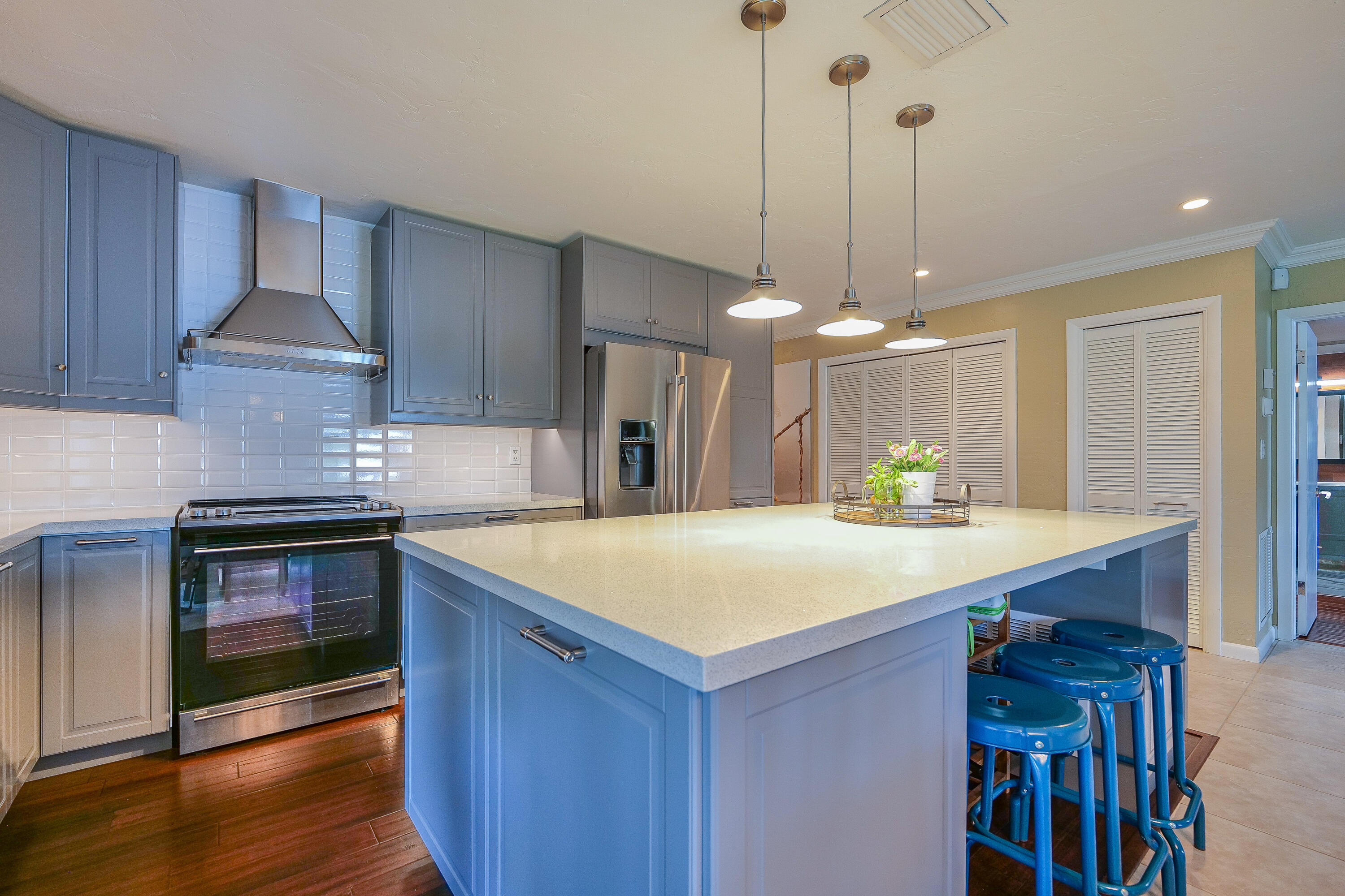 5535 Constant Spring Terrace, Unit 216 Lauderhill, FL 33319 - Photo 10 of 51 a kitchen with a center island wooden floor and a window