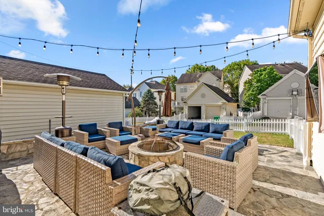 a view of a patio with couches chairs and a table