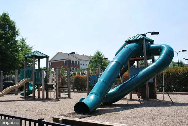 a view of a slide with sitting area