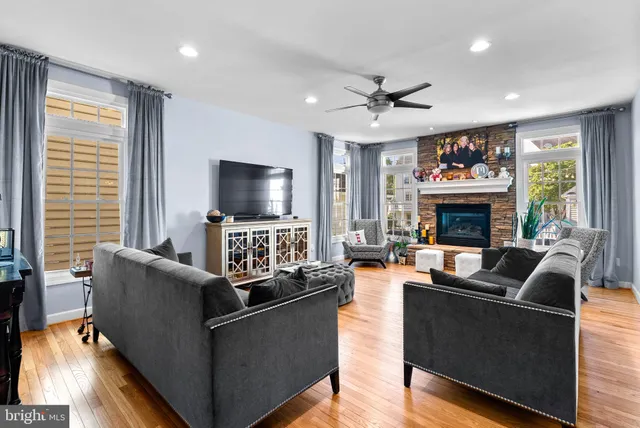 a living room with fireplace furniture and a flat screen tv