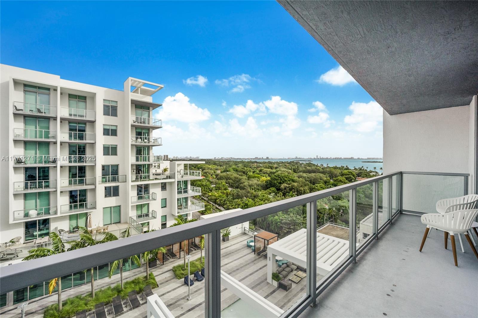 3900 Biscayne Boulevard, Unit S1016 Miami, FL 33137 - Photo 2 of 12 a view of a balcony with chairs