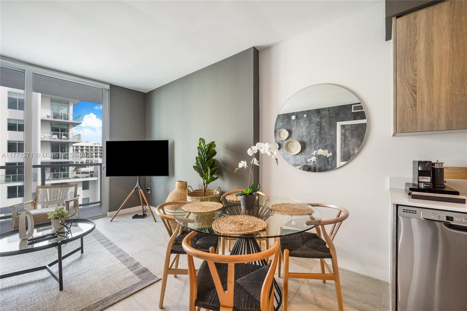 3900 Biscayne Boulevard, Unit S1016 Miami, FL 33137 - Photo 5 of 12 a view of a dining room with furniture and a potted plant