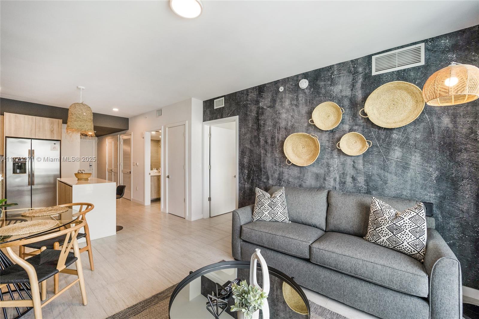 3900 Biscayne Boulevard, Unit S1016 Miami, FL 33137 - Photo 10 of 12 a living room with furniture and wooden floor