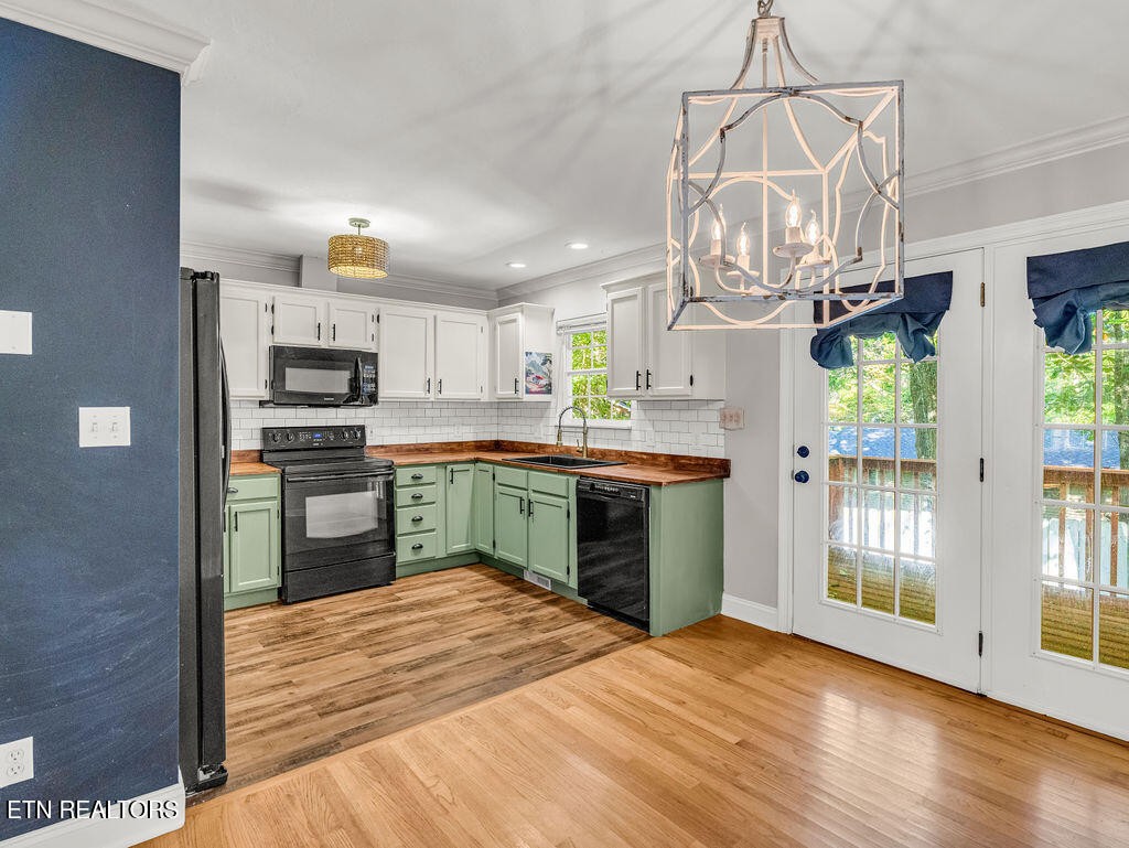 170 Cedar Circle Powell, TN 37849 - Photo 6 of 27 a kitchen with stainless steel appliances granite countertop a refrigerator and stove
