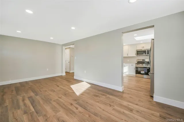 a view of a livingroom with wooden floor