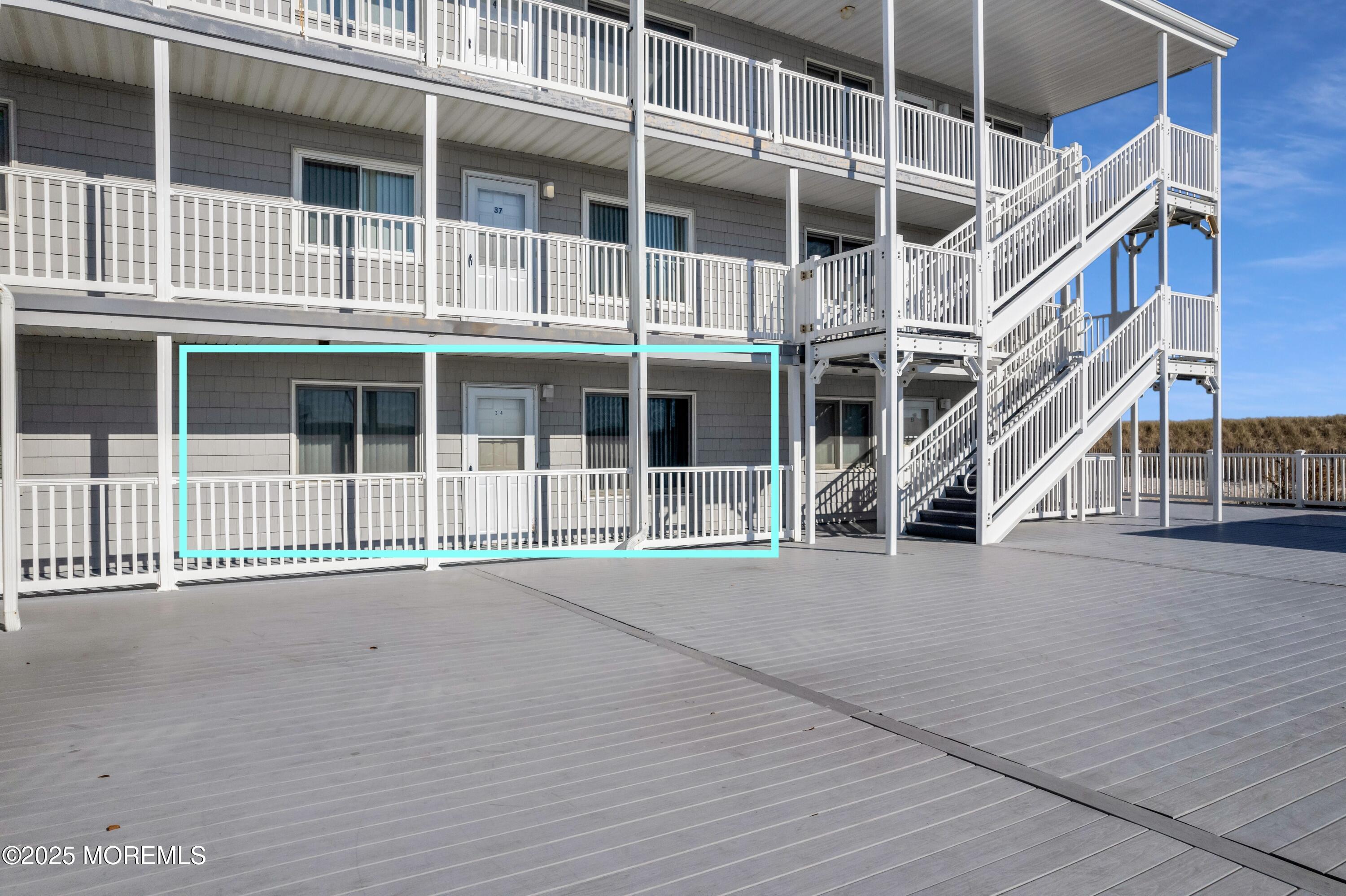 1 2nd Avenue, Unit 34 Seaside Heights, NJ 08751 - Photo 3 of 19 a view of an buildings with wooden fence