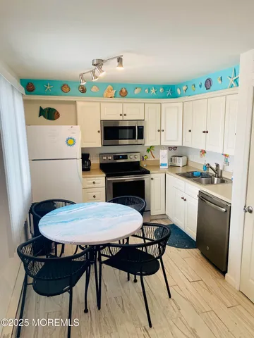 a kitchen with a table chairs and a stove