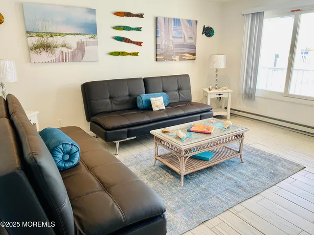 a living room with furniture and a rug