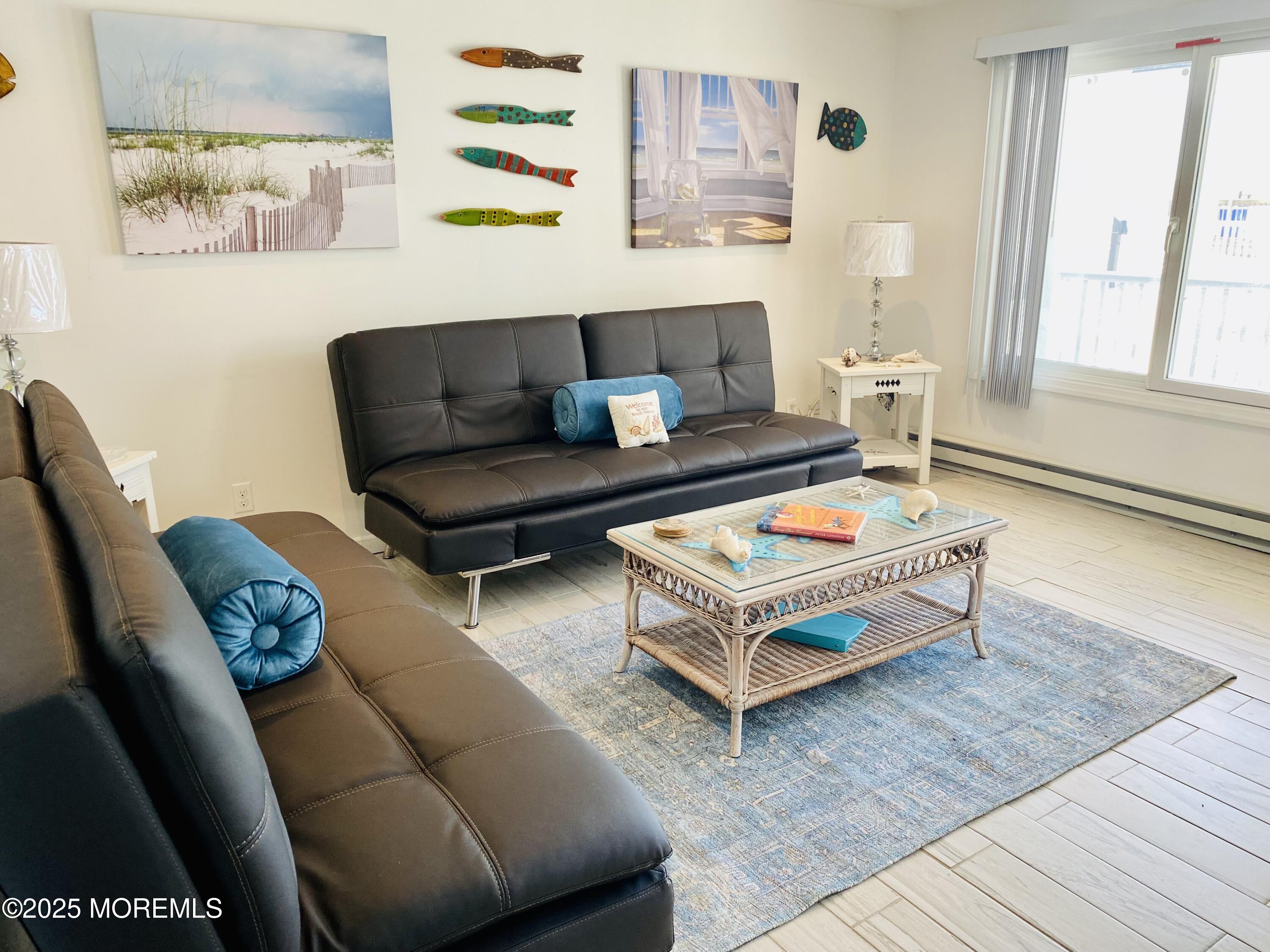 1 2nd Avenue, Unit 34 Seaside Heights, NJ 08751 - Photo 8 of 19 a living room with furniture and a rug