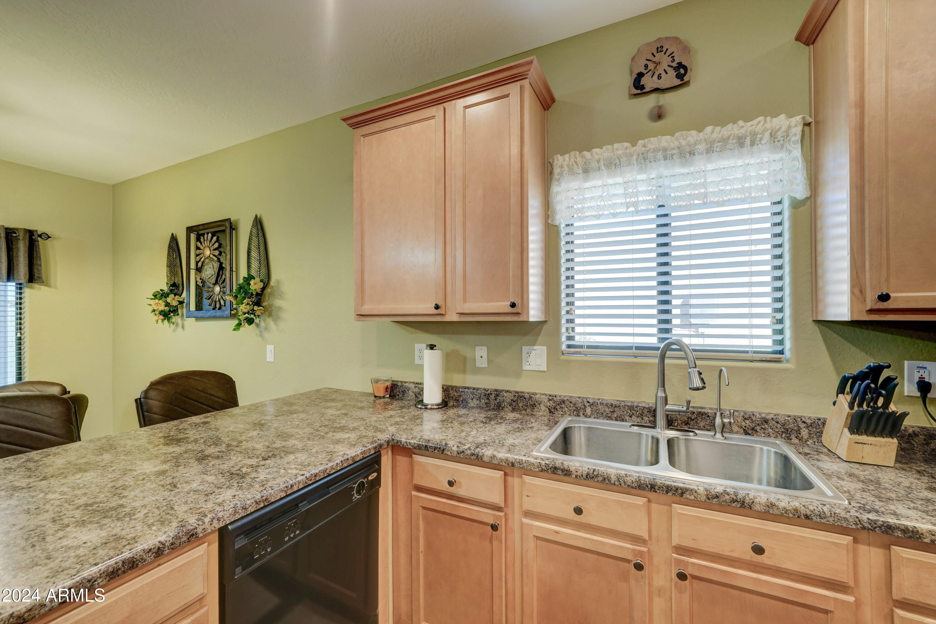 2101 South Meridian Road, Unit 131 Apache Junction, AZ 85120 - Photo 11 of 59 a kitchen with granite countertop a sink a window and cabinets