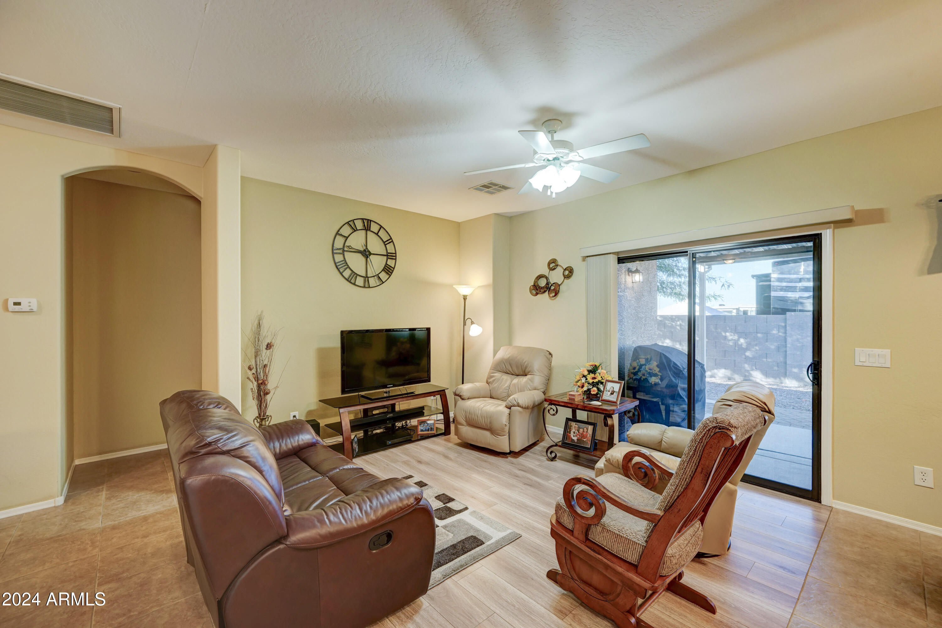 2101 South Meridian Road, Unit 131 Apache Junction, AZ 85120 - Photo 4 of 59 a living room with furniture a ceiling fan and a window