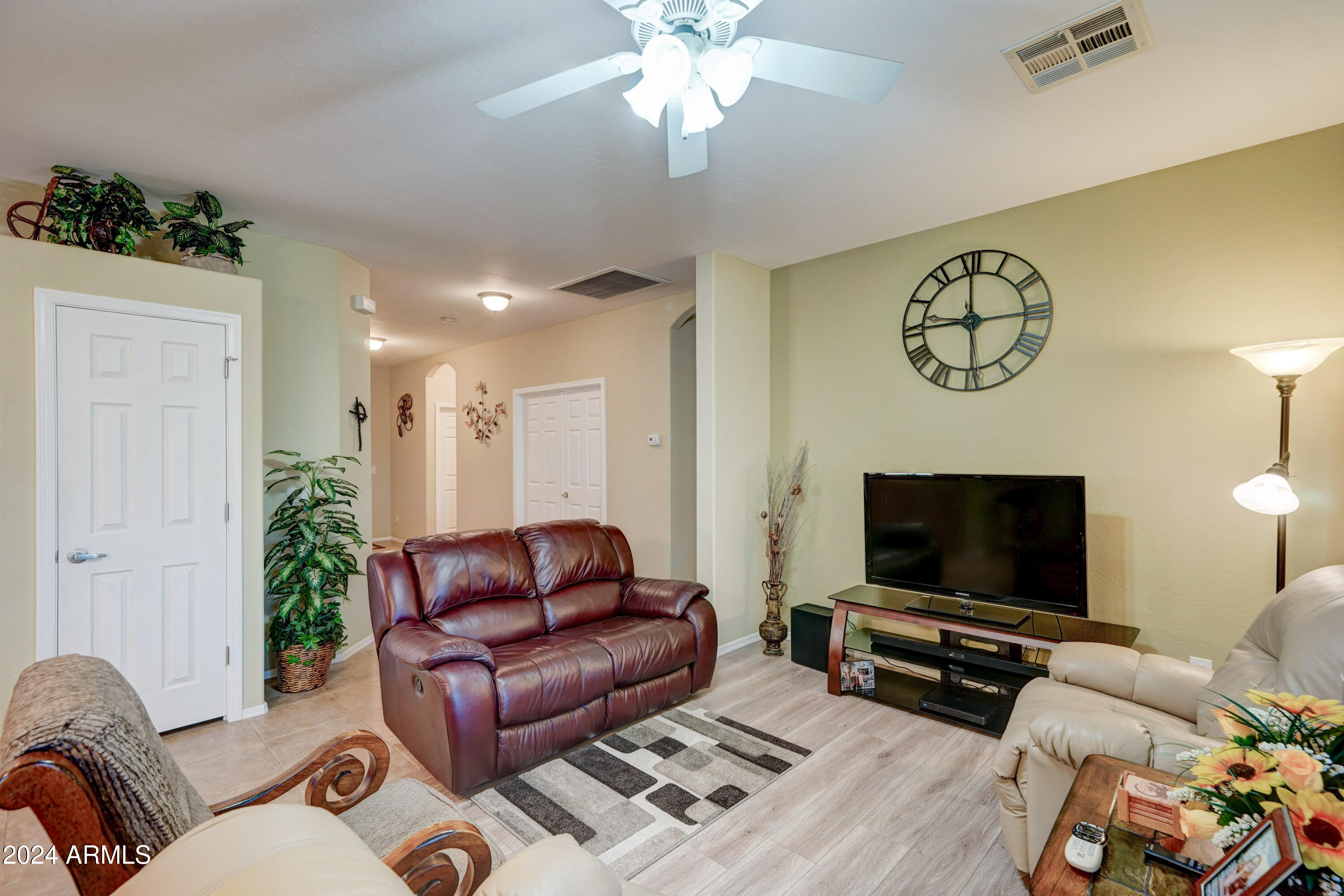 2101 South Meridian Road, Unit 131 Apache Junction, AZ 85120 - Photo 6 of 59 a living room with furniture and a flat screen tv