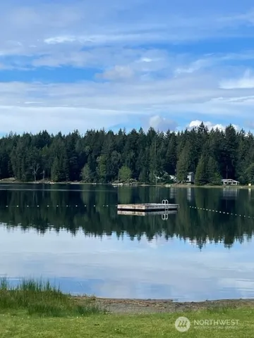 a view of lake with a yard