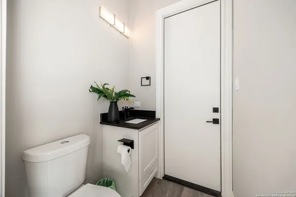a kitchen with a sink and a mirror