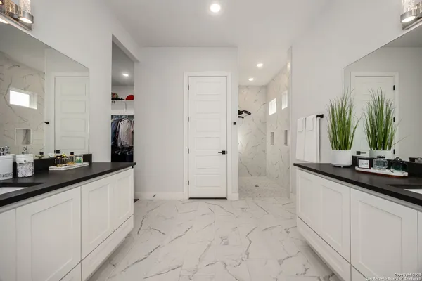 a kitchen with stainless steel appliances granite countertop a sink counter space and cabinets