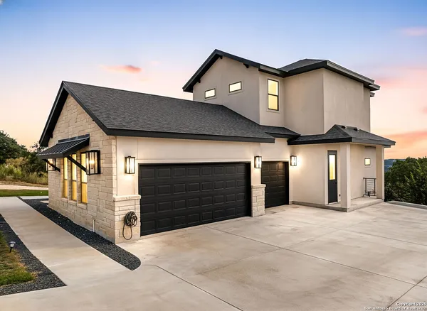 a front view of a house with a garage