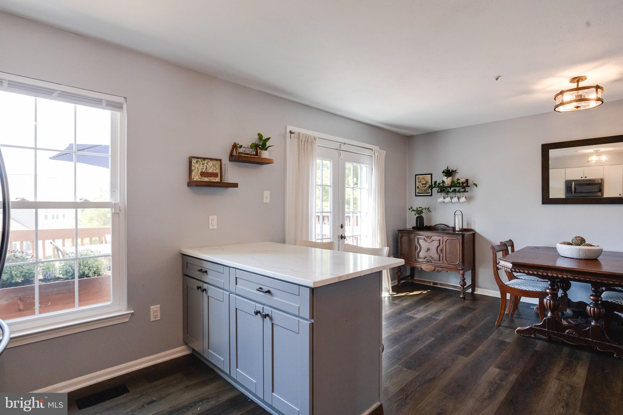 16 Sandview Court Baltimore, MD 21209 - Photo 13 of 58 a kitchen that has a sink a window and chairs in it