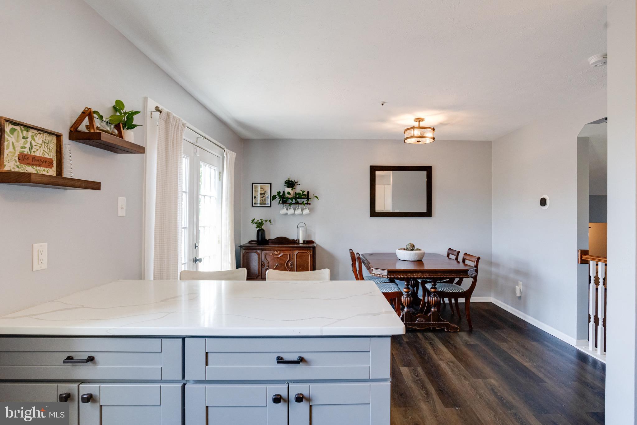 16 Sandview Court Baltimore, MD 21209 - Photo 14 of 58 a view of a dining room with furniture and wooden floor