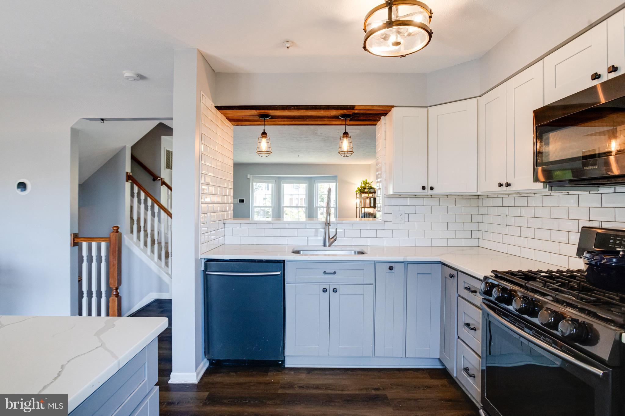 16 Sandview Court Baltimore, MD 21209 - Photo 15 of 58 a kitchen with stainless steel appliances granite countertop a stove and a sink
