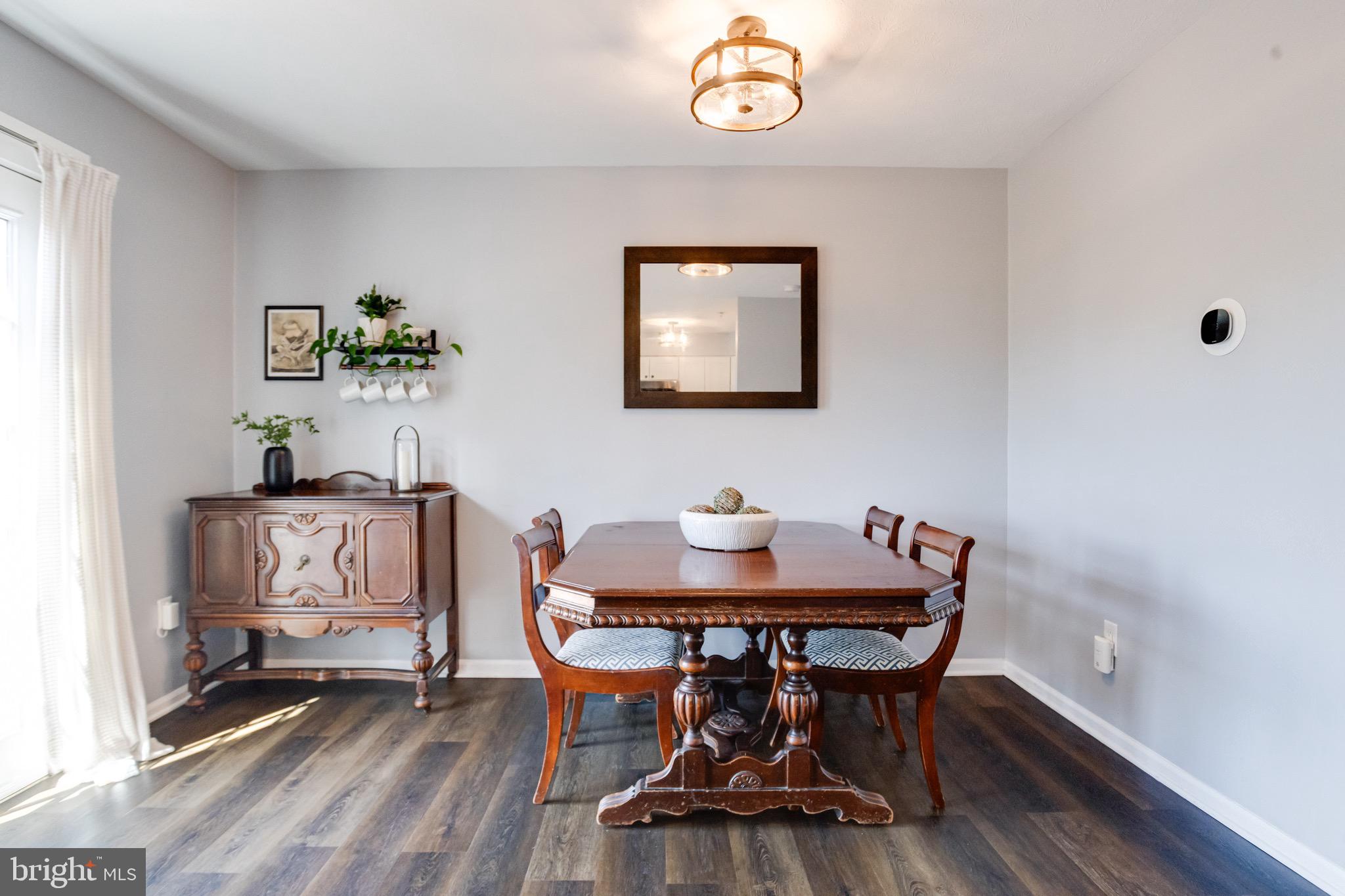 16 Sandview Court Baltimore, MD 21209 - Photo 16 of 58 a view of a dining room with furniture and wooden floor