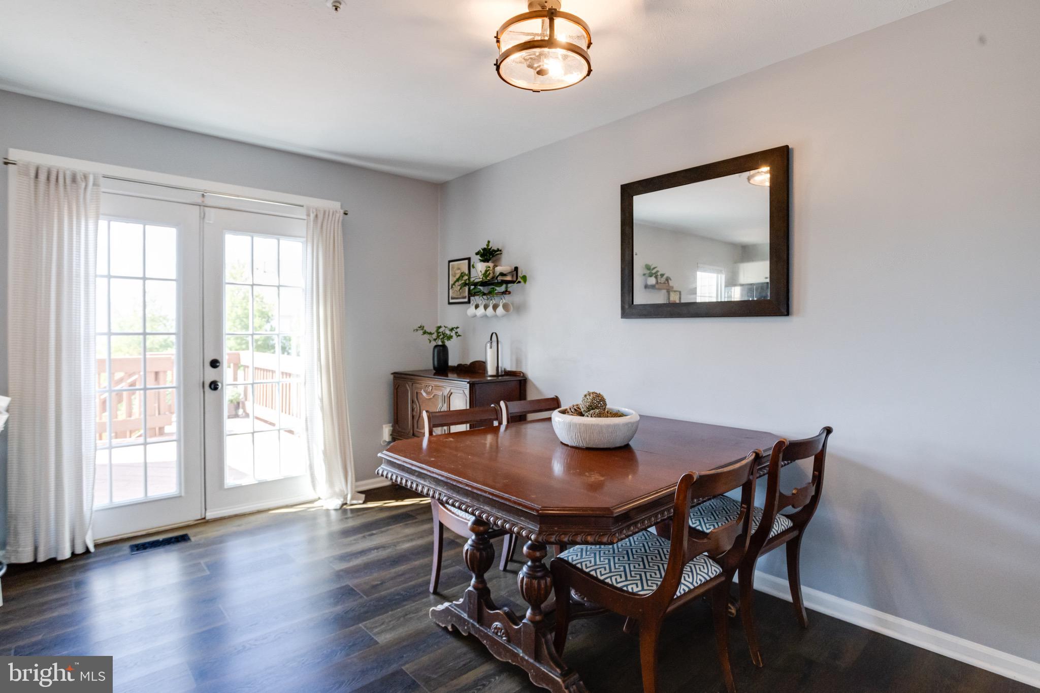 16 Sandview Court Baltimore, MD 21209 - Photo 18 of 58 a view of a dining room with furniture window and wooden floor