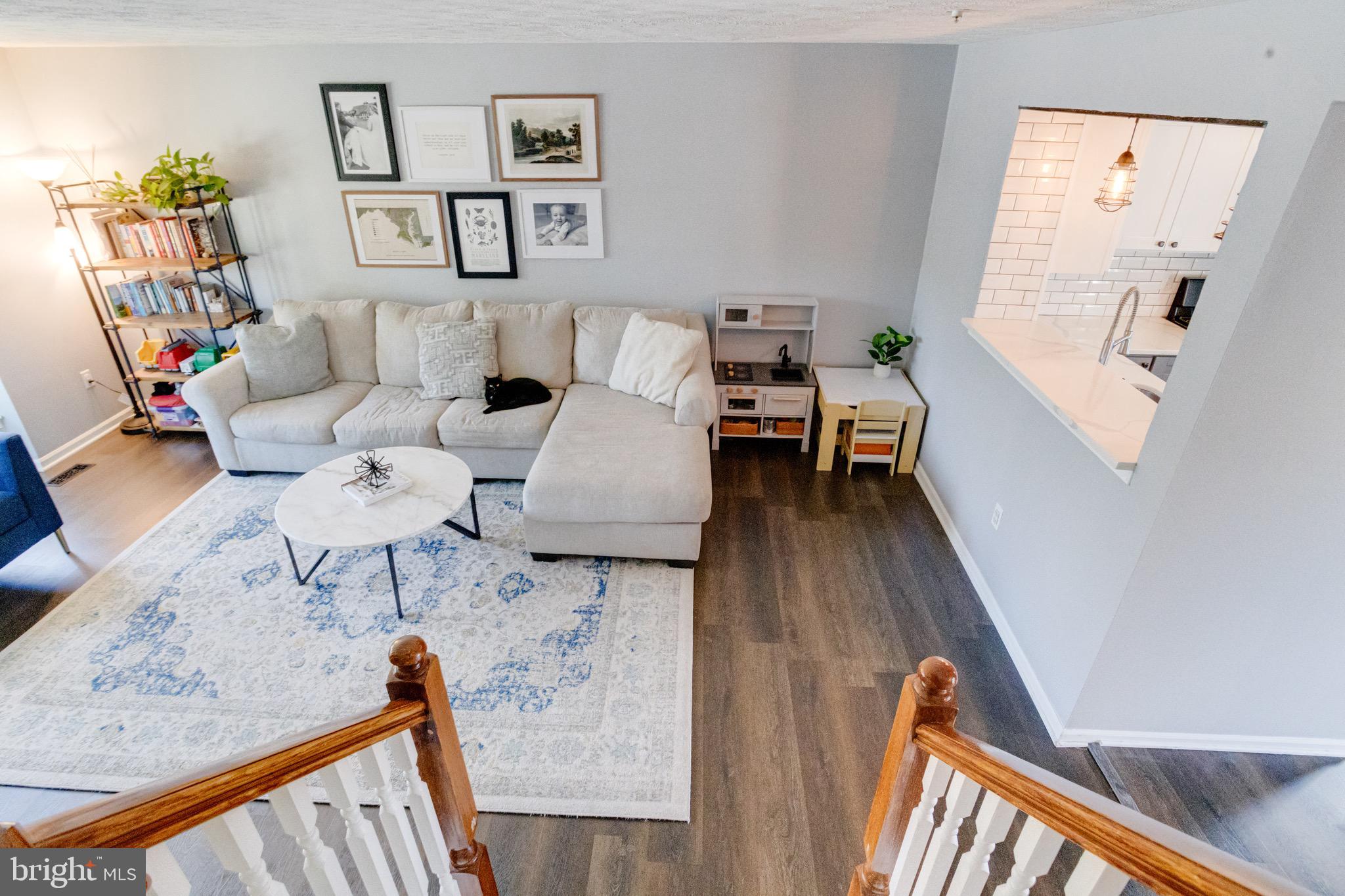 16 Sandview Court Baltimore, MD 21209 - Photo 2 of 58 a living room with furniture and a wooden floor