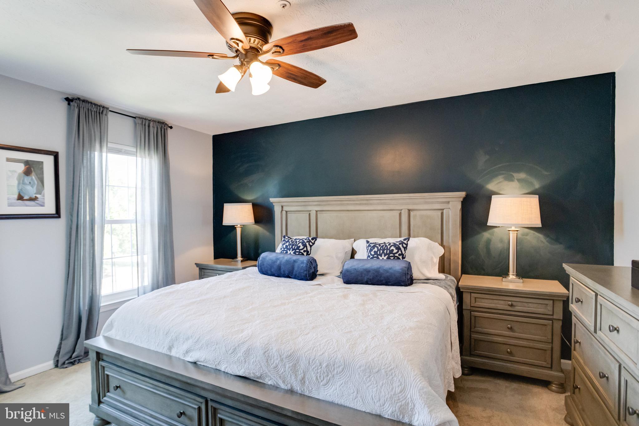 16 Sandview Court Baltimore, MD 21209 - Photo 23 of 58 a bedroom with a bed and a chandelier