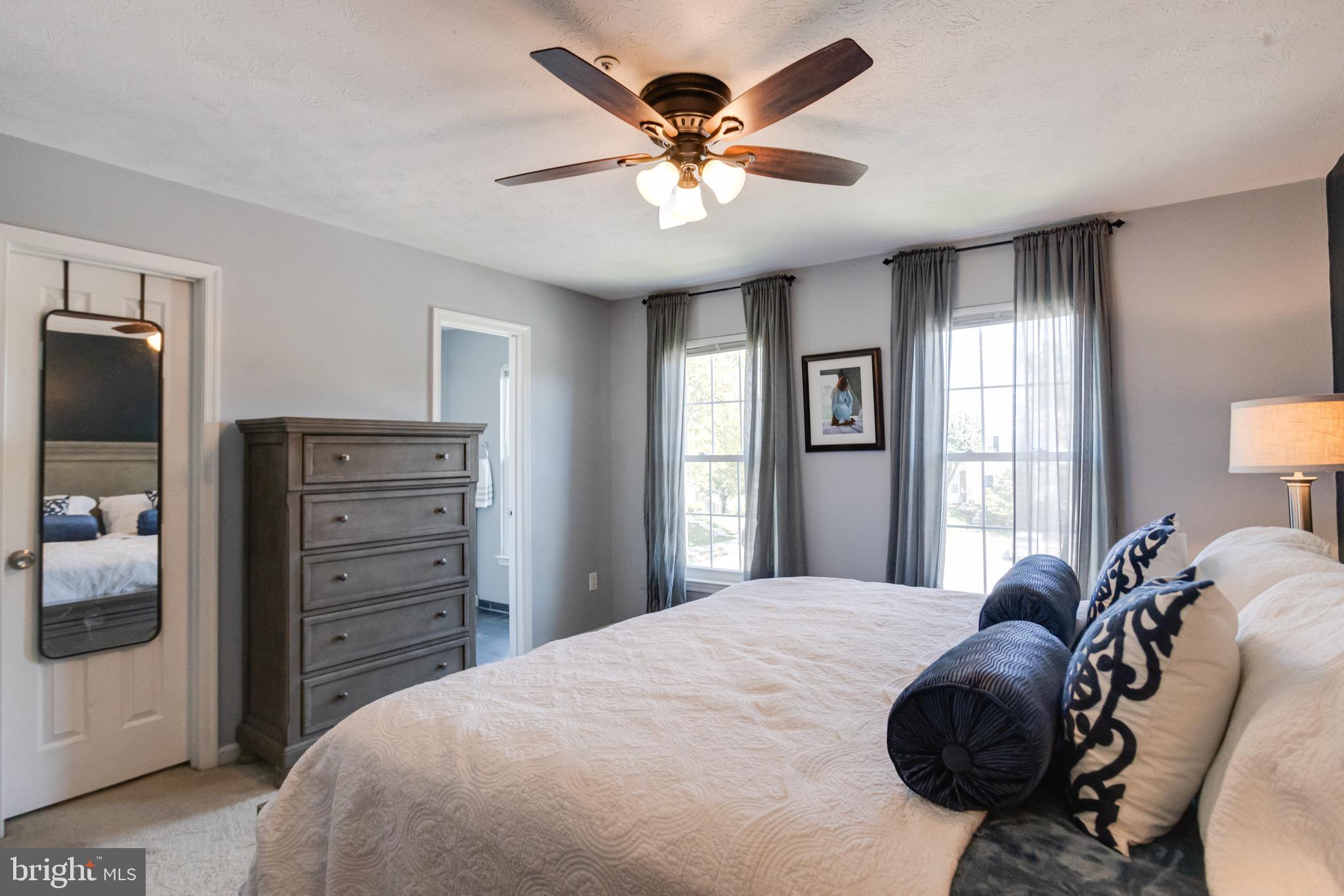 16 Sandview Court Baltimore, MD 21209 - Photo 24 of 58 a bedroom with a bed and a chandelier