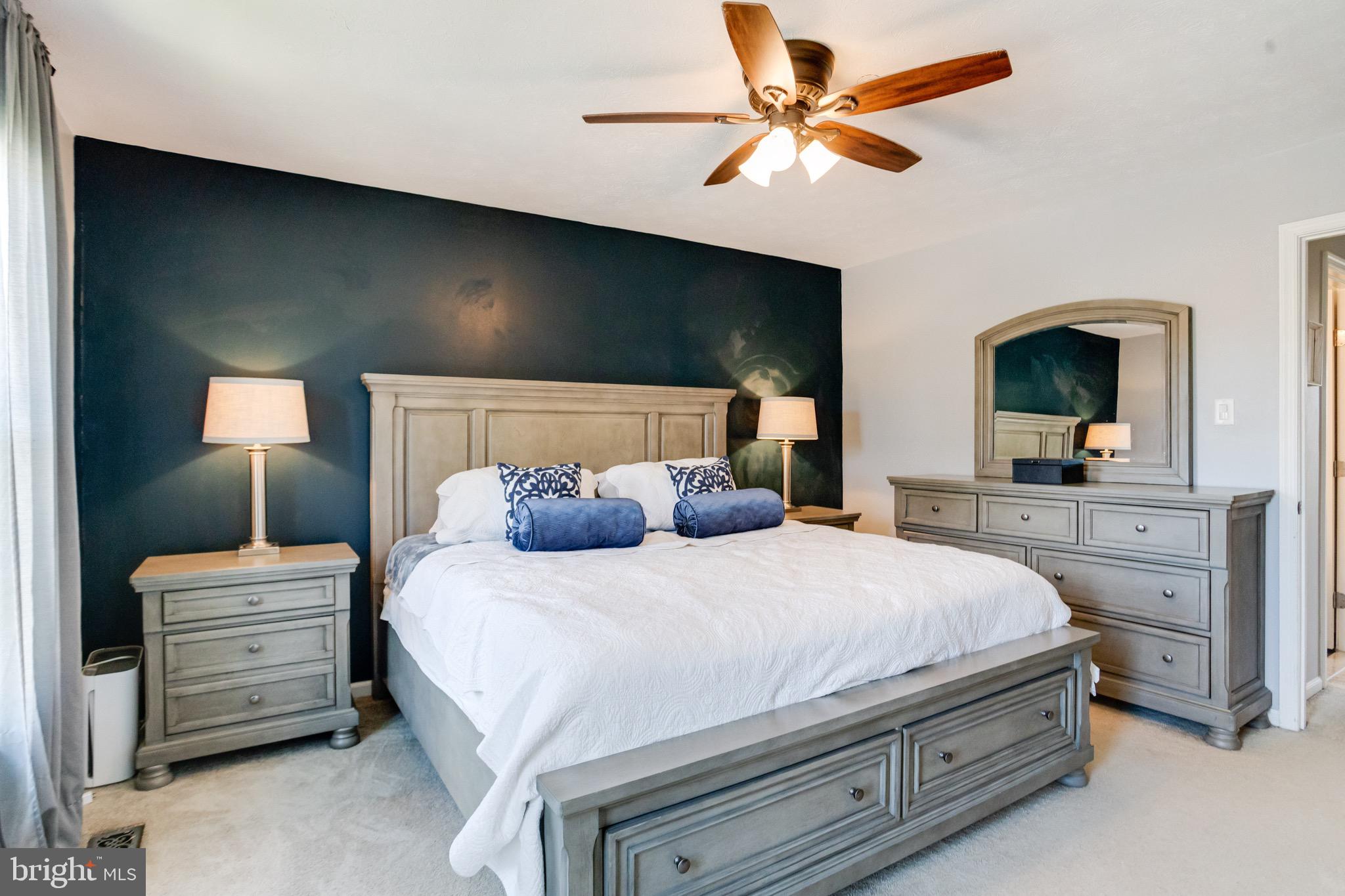 16 Sandview Court Baltimore, MD 21209 - Photo 25 of 58 a bedroom with a bed and a chandelier