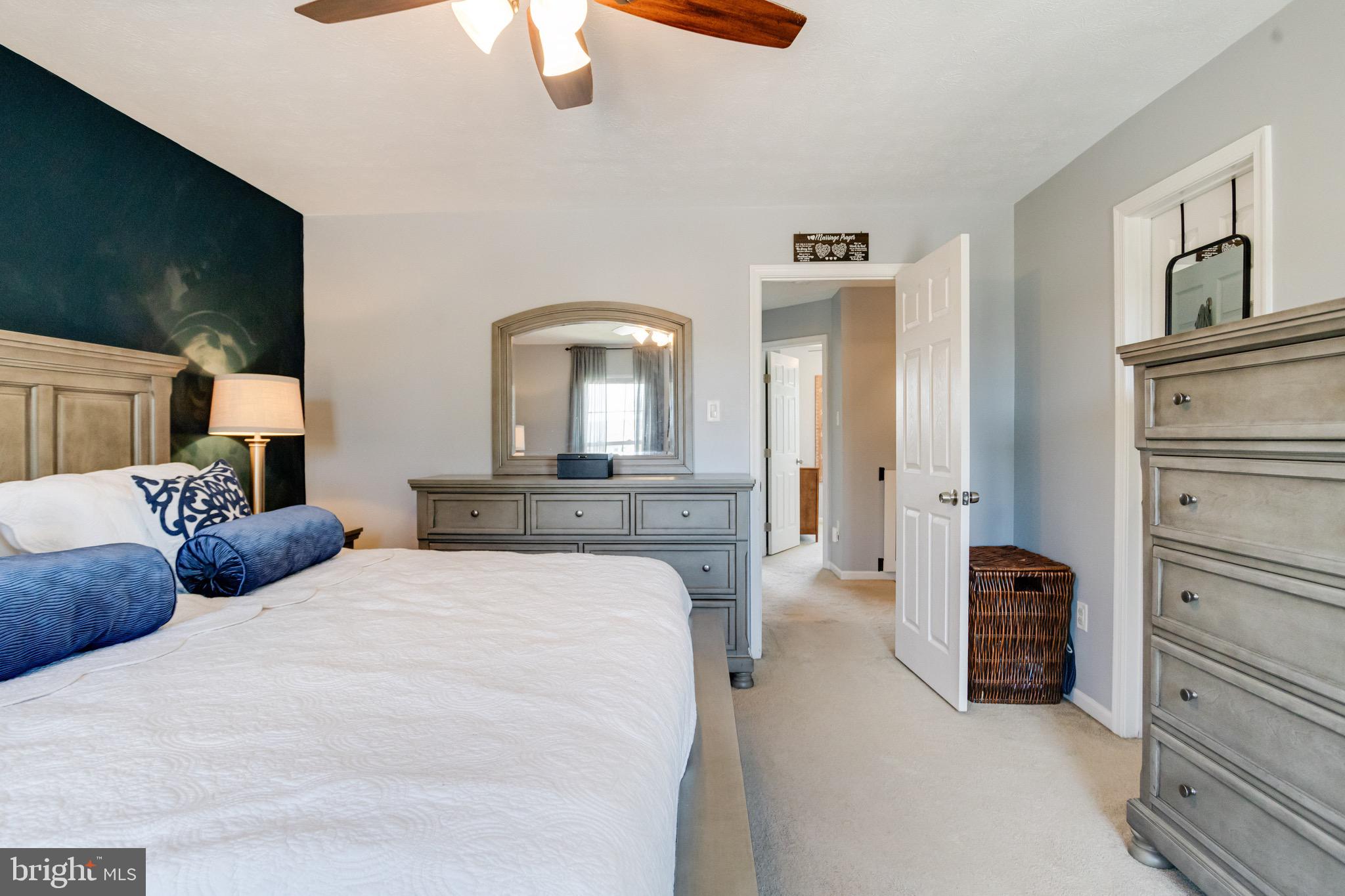 16 Sandview Court Baltimore, MD 21209 - Photo 26 of 58 a bedroom with bed and a chandelier