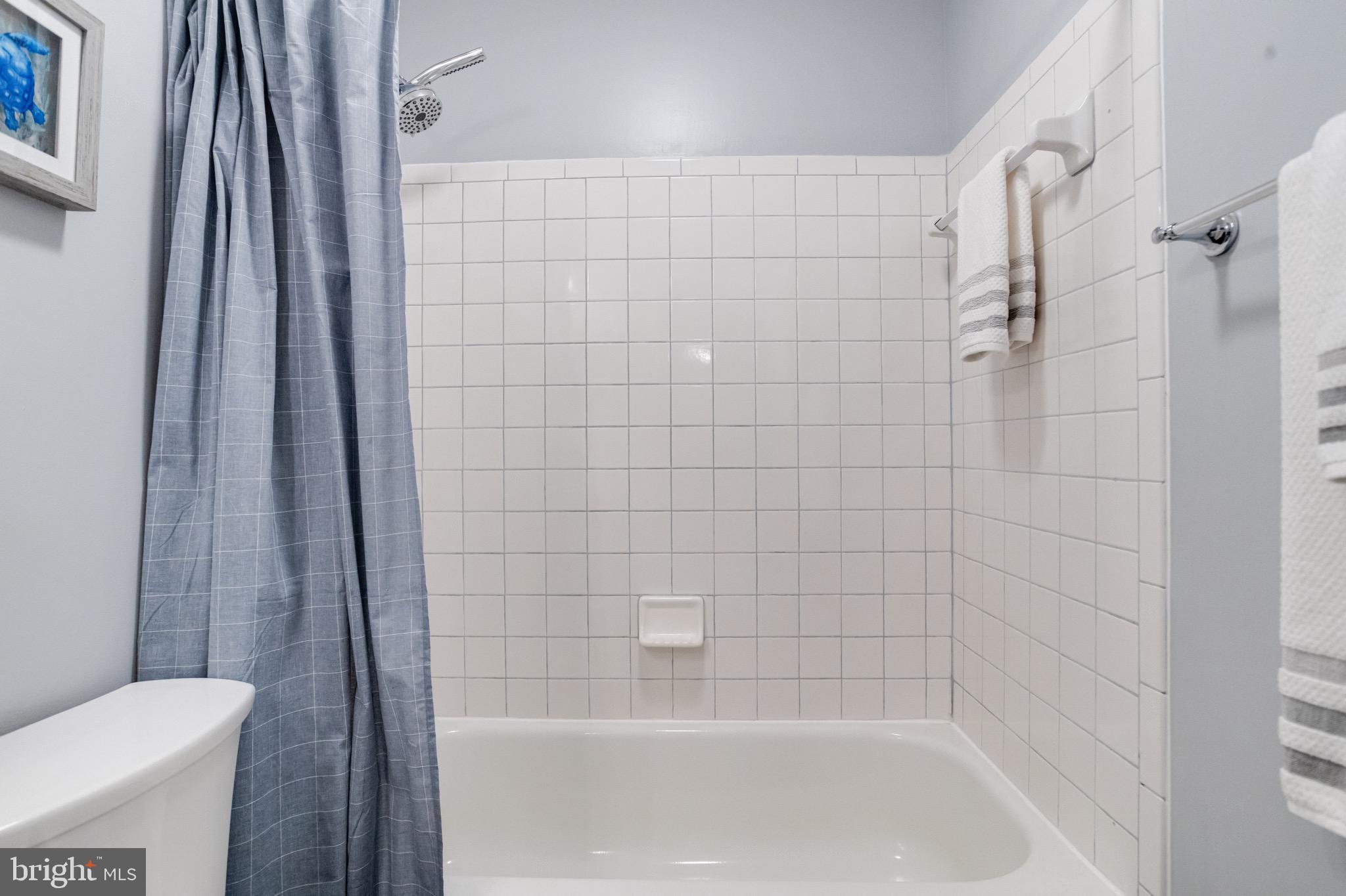 16 Sandview Court Baltimore, MD 21209 - Photo 37 of 58 a bathroom with a shower and toilet