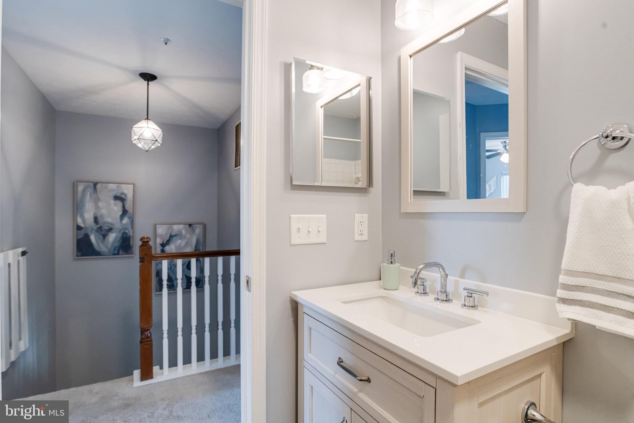 16 Sandview Court Baltimore, MD 21209 - Photo 38 of 58 a bathroom with a sink and a mirror