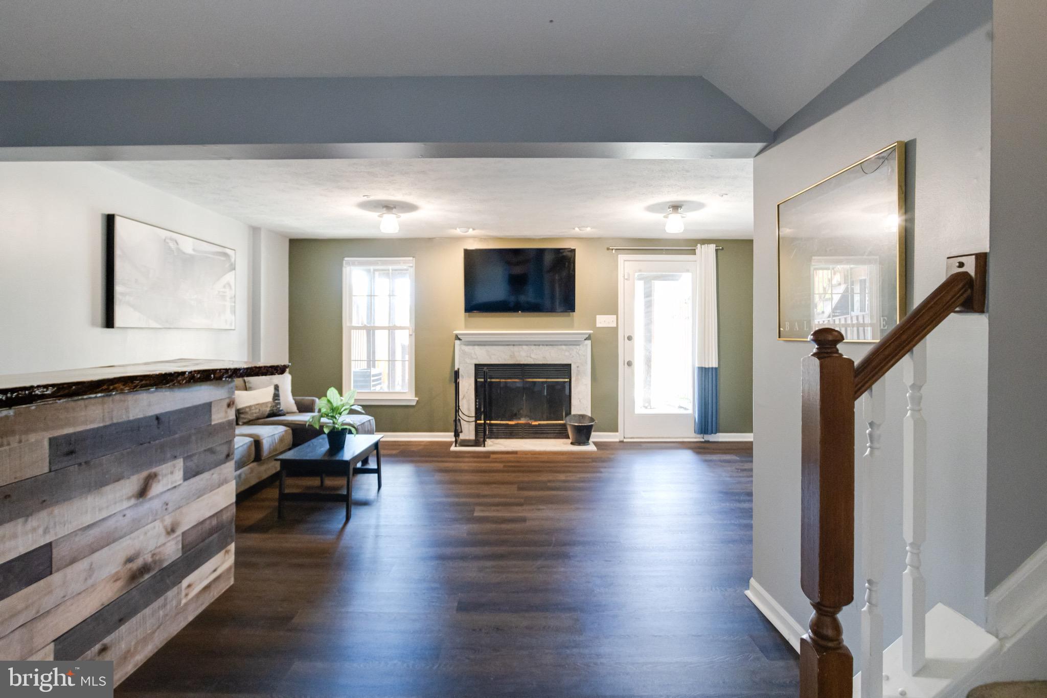 16 Sandview Court Baltimore, MD 21209 - Photo 39 of 58 a living room with furniture fireplace and flat screen tv