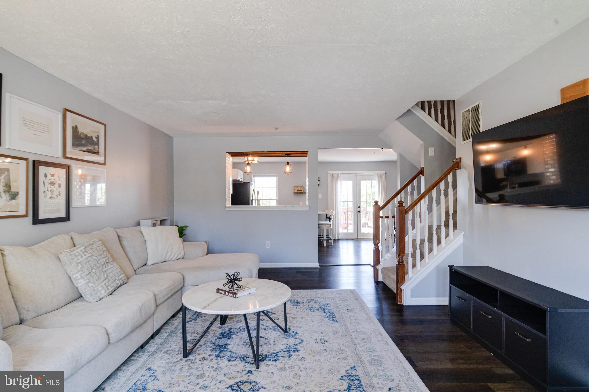 16 Sandview Court Baltimore, MD 21209 - Photo 4 of 58 a living room with furniture and a flat screen tv