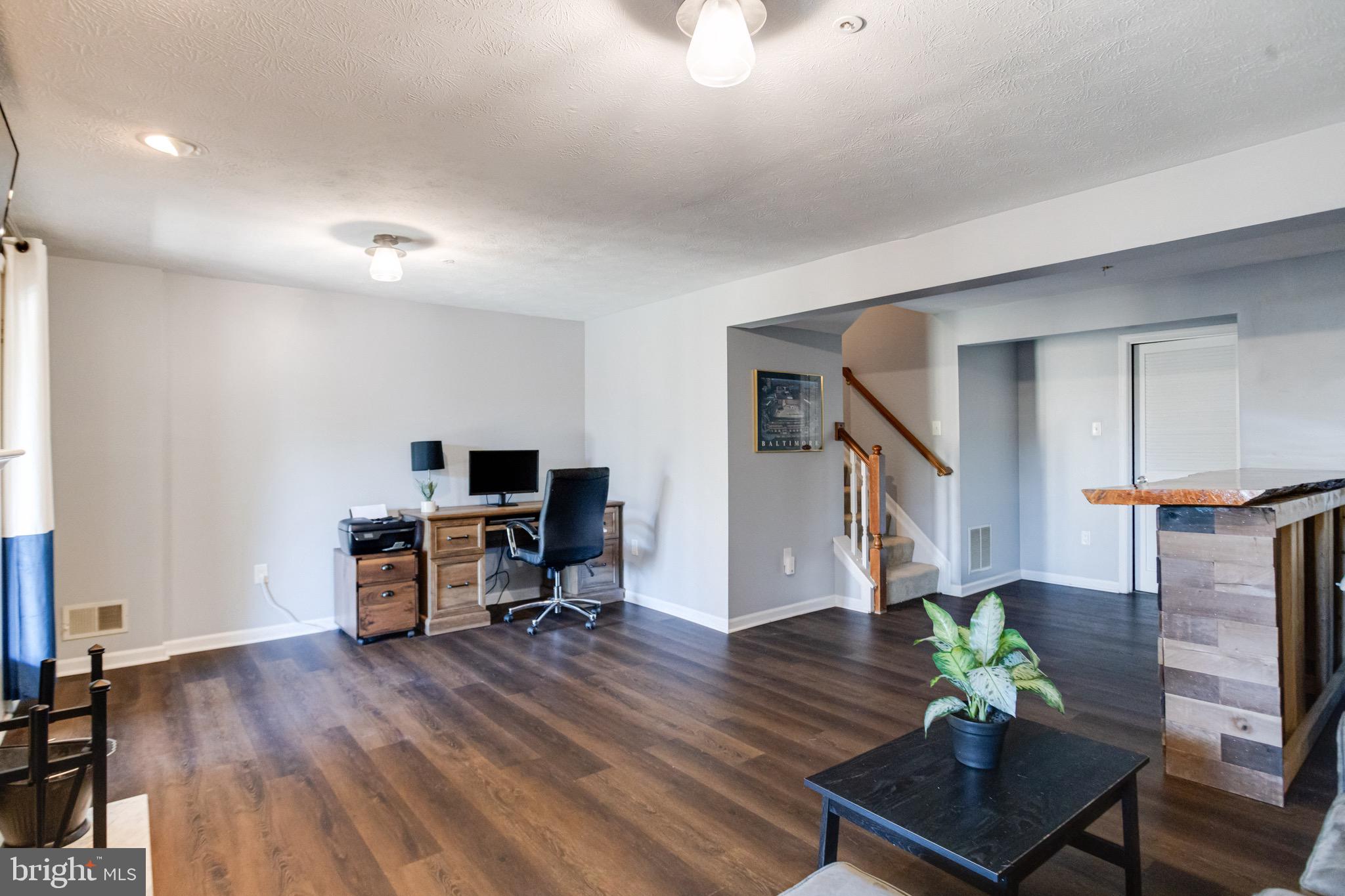 16 Sandview Court Baltimore, MD 21209 - Photo 43 of 58 a living room with furniture and a wooden floor