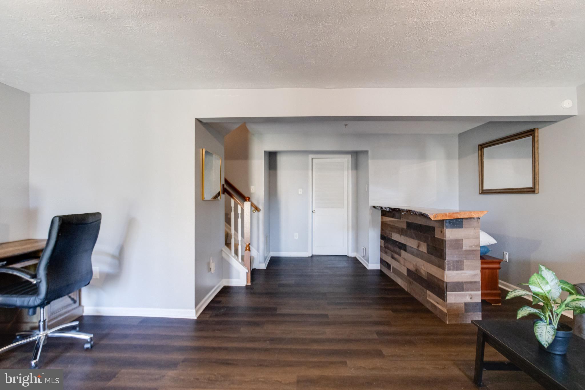16 Sandview Court Baltimore, MD 21209 - Photo 44 of 58 a view of a workspace with furniture and wooden floor
