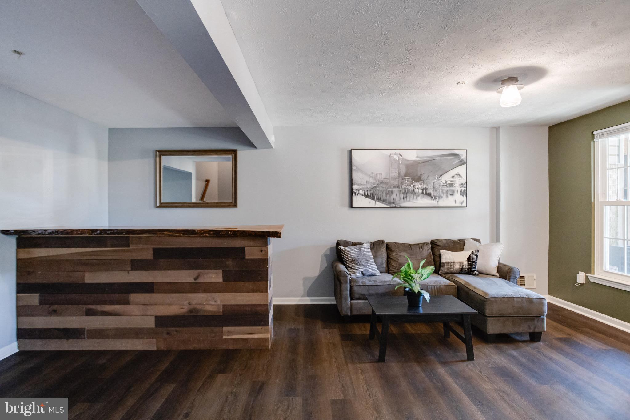 16 Sandview Court Baltimore, MD 21209 - Photo 46 of 58 a living room with furniture and wooden floor