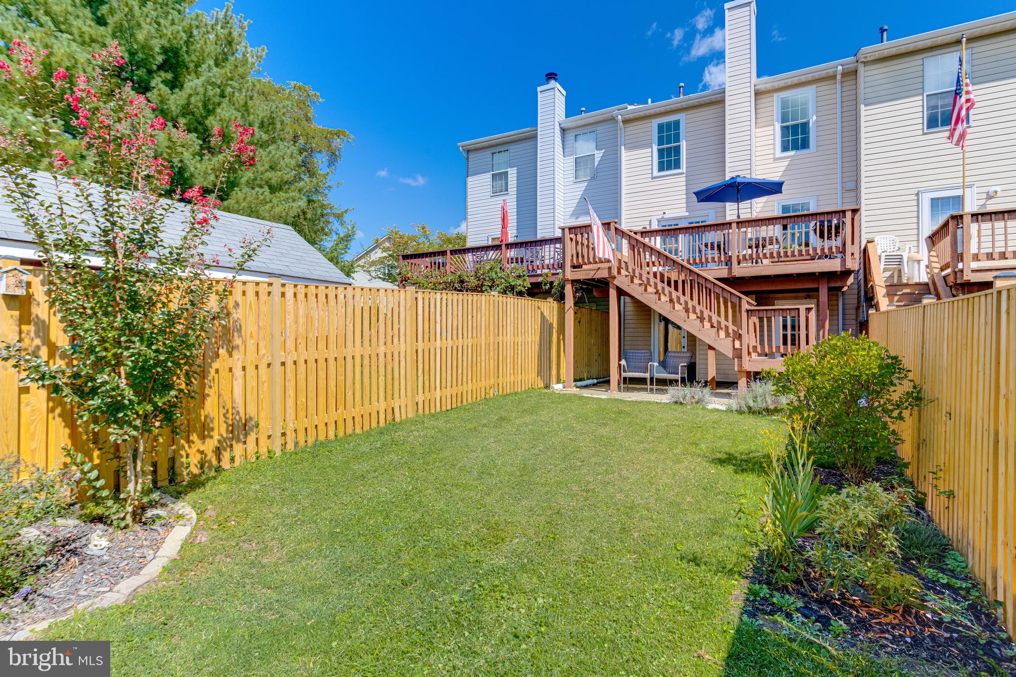 16 Sandview Court Baltimore, MD 21209 - Photo 54 of 58 a front view of a house with a garden and plants