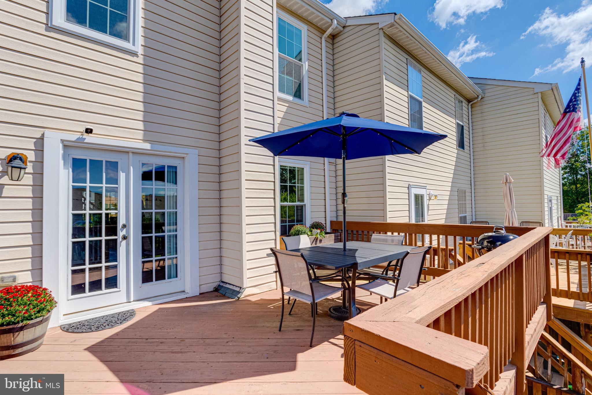 16 Sandview Court Baltimore, MD 21209 - Photo 56 of 58 a view of a patio with a table and chairs under an umbrella